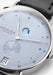 Closeup of the dial shows the power reserve and the seconds subdial azurage finish.