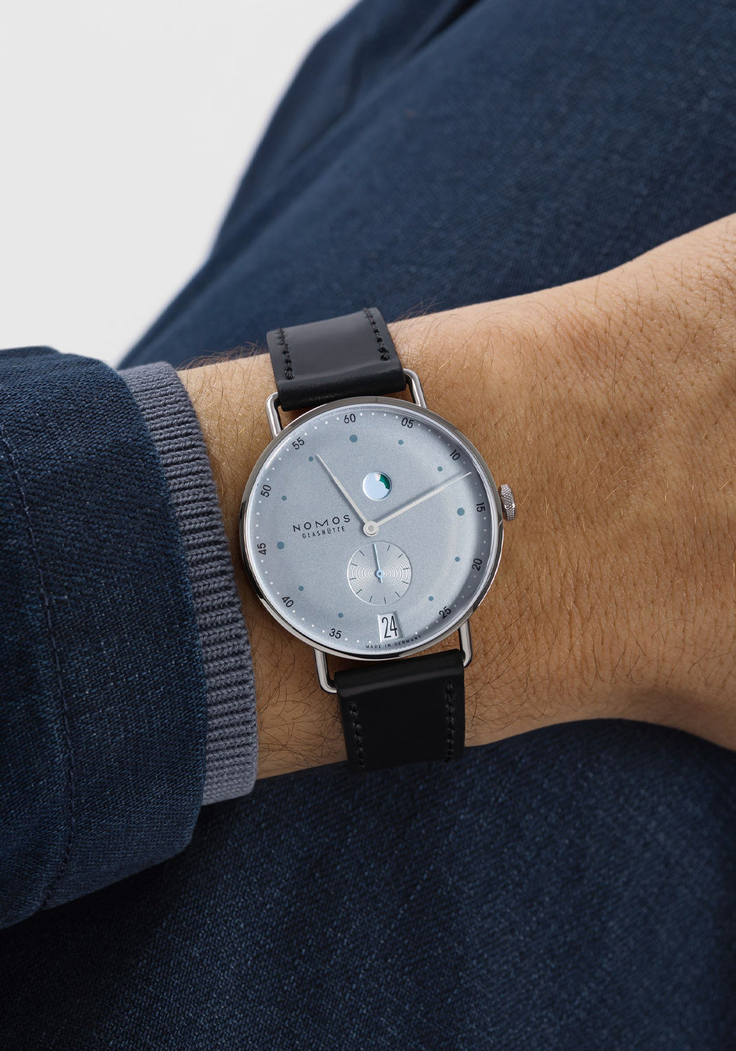 NOMOS Metro Date Power Reserve Ice Blue on a man's wrist | Denver Watches | OsterJewelers.com
