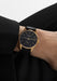 The NOMOS Orion Gold Neomatik New Black 36mm shines on the wrist with its black dial & gold accents
