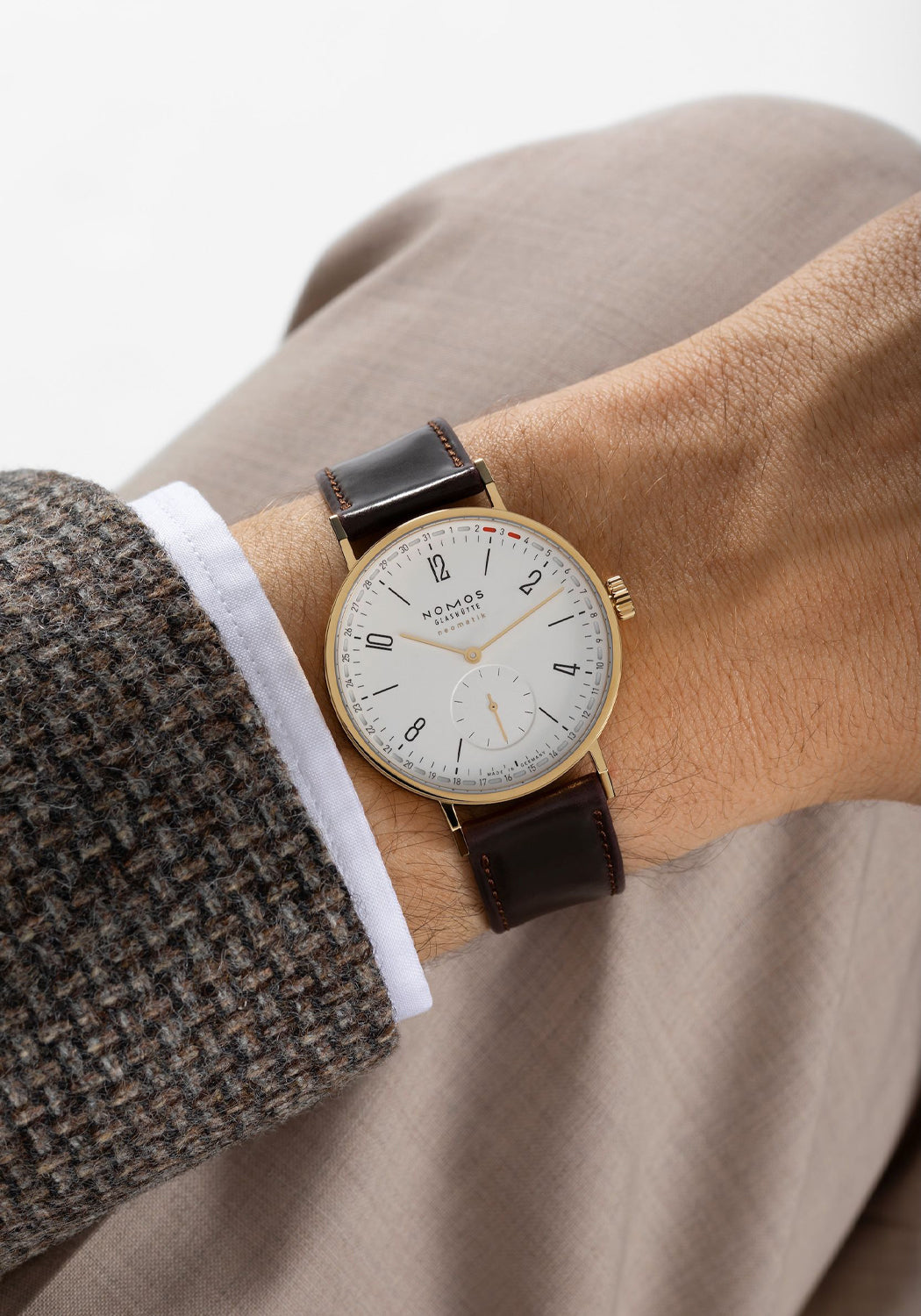 NOMOS Tangente Gold Neomatik 38 Update Doré on the wrist | 196 | Denver Watches | OsterJewelers.com
