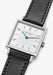 Angled view of the NOMOS Tetra 27 Duo highlights the white dial and smaller centered grey square.