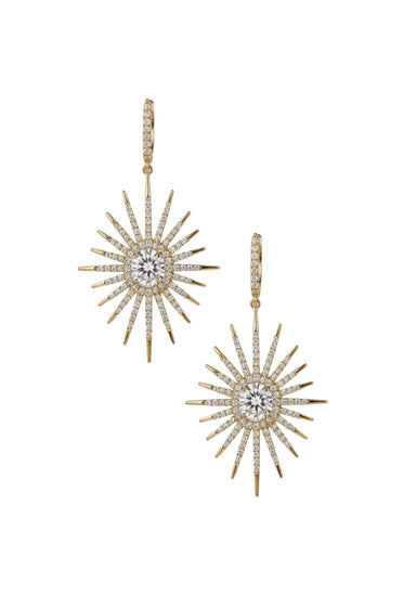 A pair of gold starburst drop earrings with white & grey diamonds, displayed on a solid white background.