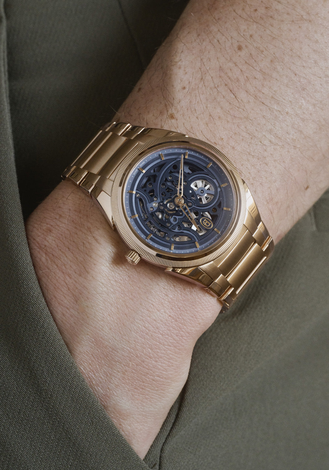 Parmigiani Fleurier Tonda PF Skeleton Rose Gold Milano Blue on a man's wrist | OsterJewelers.com
