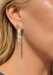 Model wearing 18K yellow gold baguette and round diamond dangle.