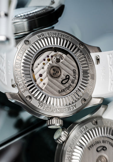 Sartory-Billard SB10 Jumping Hour Disco Ball Caseback (shown on rubber) | OsterJewelers.com
