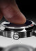Close-up of finger touching the Blue-Aventurine Dial on the Sartory Billard Blue Aventurine
