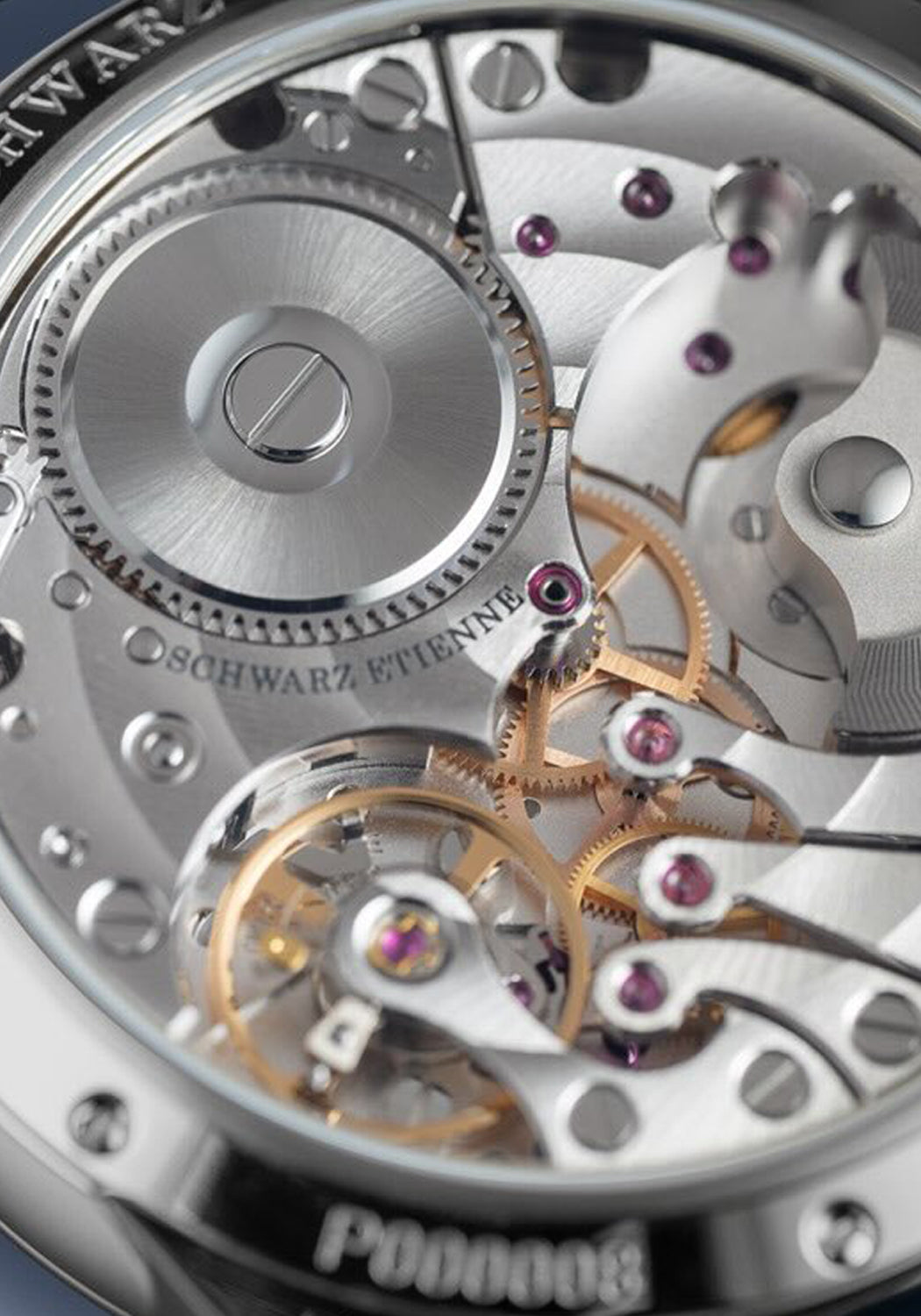 A closeup of the  Calibre ASE 320.00 shown through the sapphire glass exhibition caseback.
