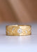 A close up of the Sethi Fleur band shows off clusters of diamonds highlighting the floral design.