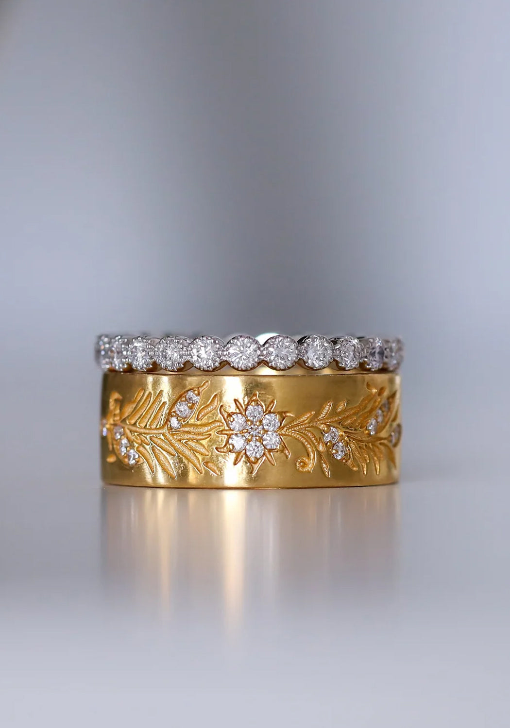 A simple Sethi Couture stack featuring the Fleur band and an 18KWG bezel set diamond eternity band.
