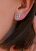 Closeup of a Sethi Couture Logan 18K Rose Gold Halo Rose Cut Diamond Stud Earring on a model's ear
