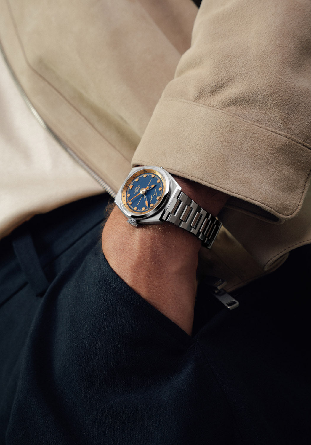 Singer Reimagined 1970 DualTrack Cobalt Blue on a man's wrist | OsterJewelers.com
