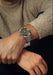 The Singer Reimagined 1970 DualTrack Espresso shown on a man's wrist | OsterJewelers.com