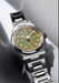 The Singer Reimagined 1970 DualTrack Khaki features a warm khaki green dial | OsterJewelers.com
