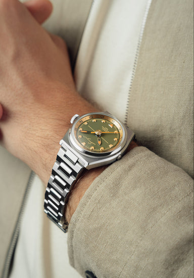 Singer Reimagined 1970 DualTrack Khaki on a man's wrist | Luxury Watches | OsterJewelers.com