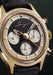 A closeup of the dial shows 3 white chronograph counters that stand out against the deep black dial