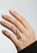 Shown on a mode's hand, the trailing design of the Sybarite Falling Star Ring can be worn up or down