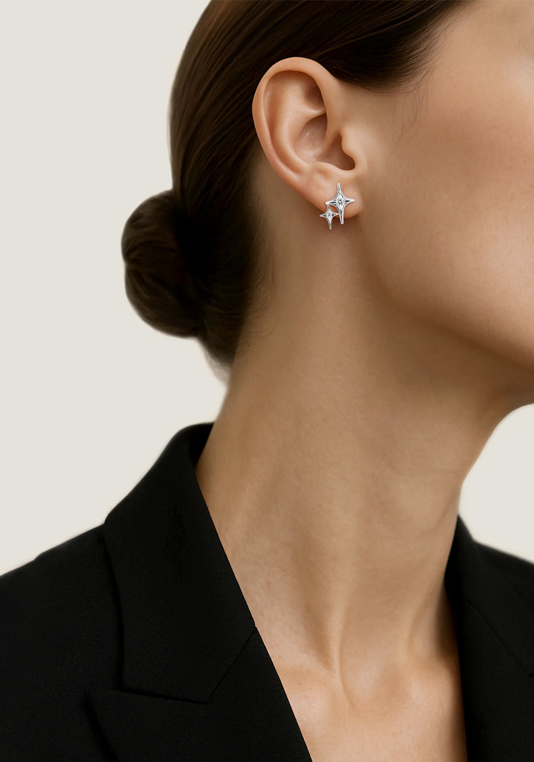 Sybarite Falling Stars 18KWG Diamond Double Star Stud Earring on a model wearing a black blazer