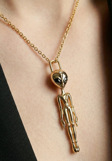 The Sybarite She’s an Alien Pendant Necklace features large alien head with sapphire eyes and star