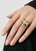The eyes of the Sybarite She's an Alien Ring are made of sapphires. Shown on a model's hand.