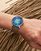 Louis Erard Marqueterie de Paille shown against a natural straw background | OsterJewelers.com