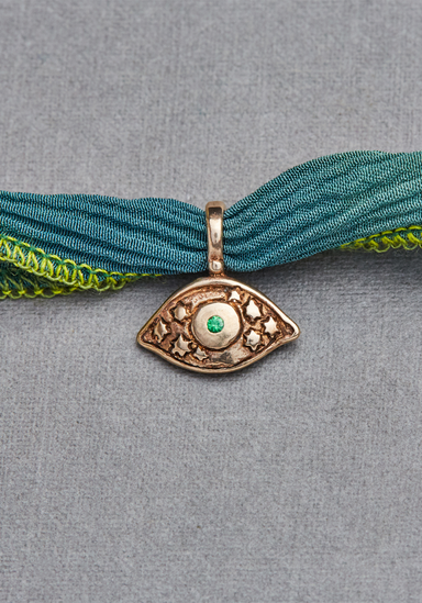 Catherine Michiels 14K Yellow Gold Tsavorite Evil Eye Charm on Silk (Style Idea) | OsterJewelers.com