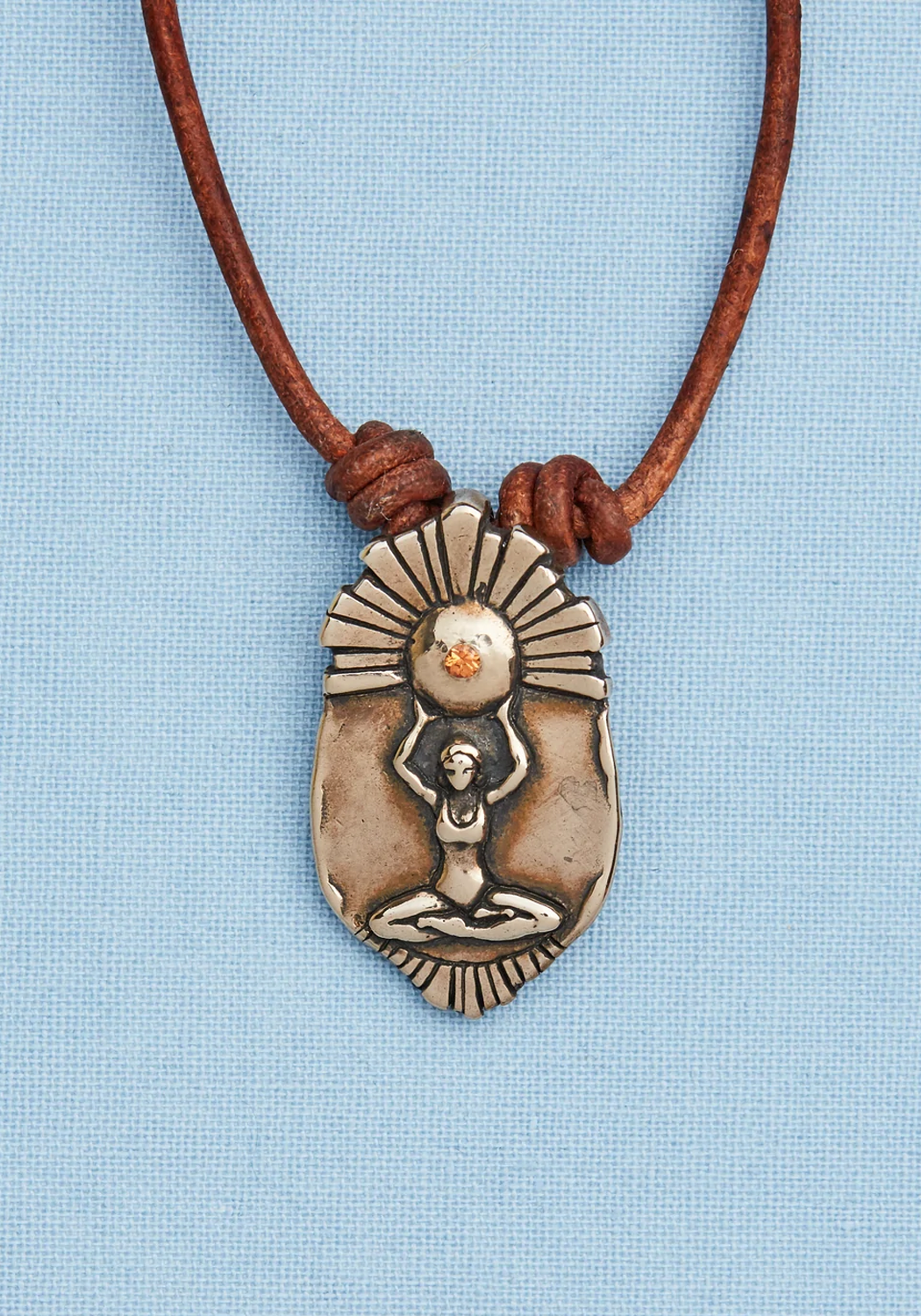 Catherine Michiels Bronze Surya Sun Goddess Charm on Leather (style idea) | OsterJewelers.com